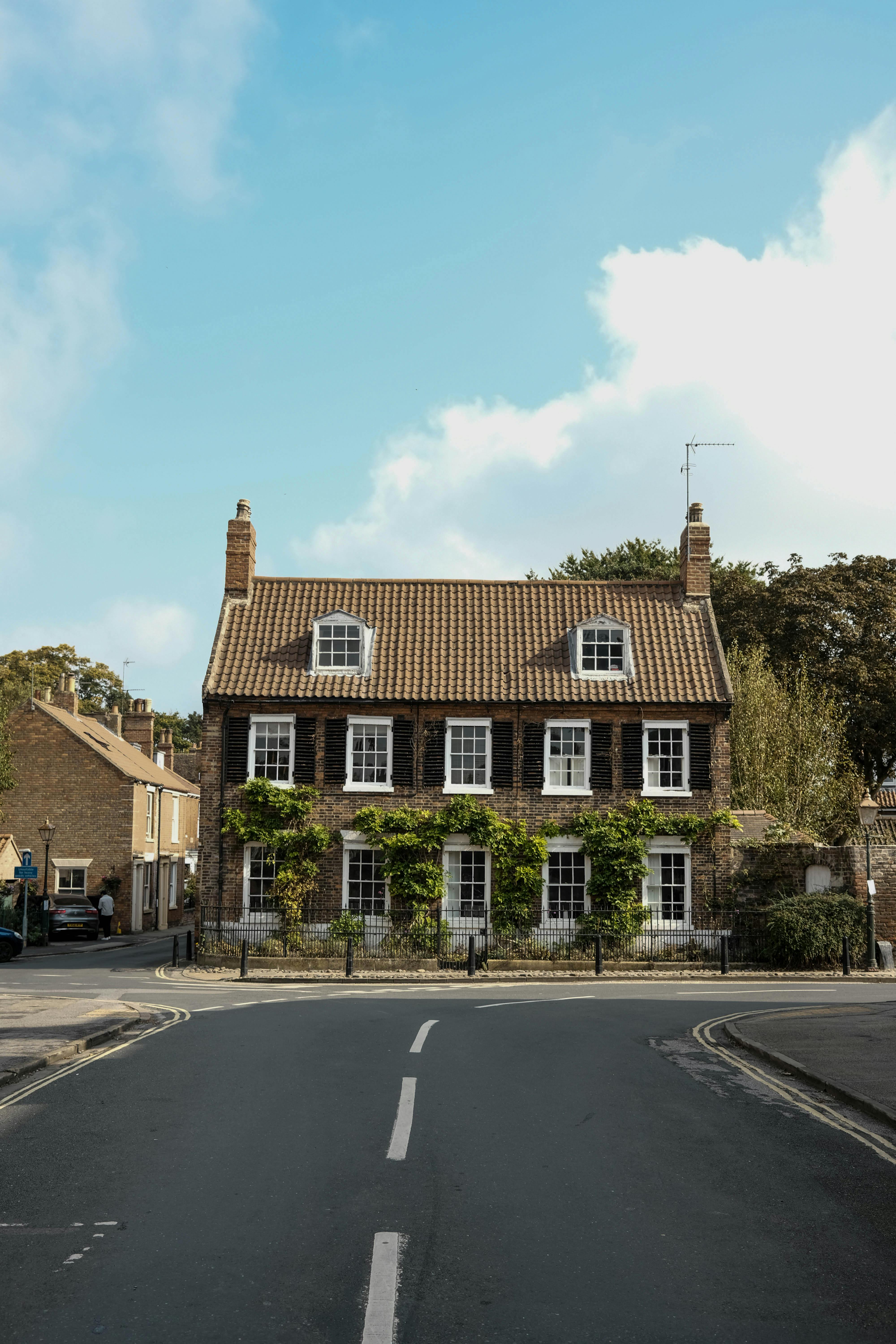 A row of houses on a calm street in daylight